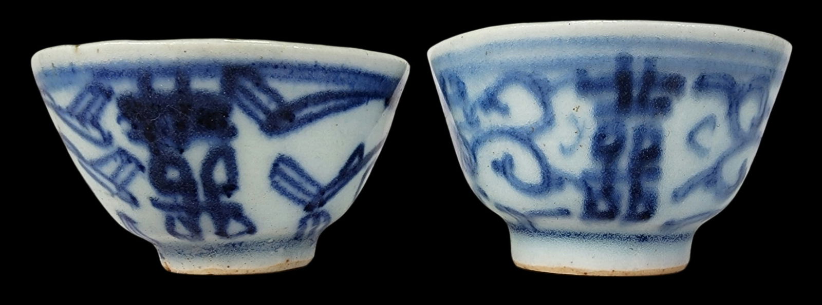 Pair of Antique Chinese Qing Dynasty Tongzhi Blue & White Porcelain Tea Cups: Pair of Mid-Qing Dynasty tea cups featuring a Shuangxi (Double Happiness) design. Good antique condition with some wear according to age. Each measures approx. 1 3/8" high x 2 1/4" in diameter.