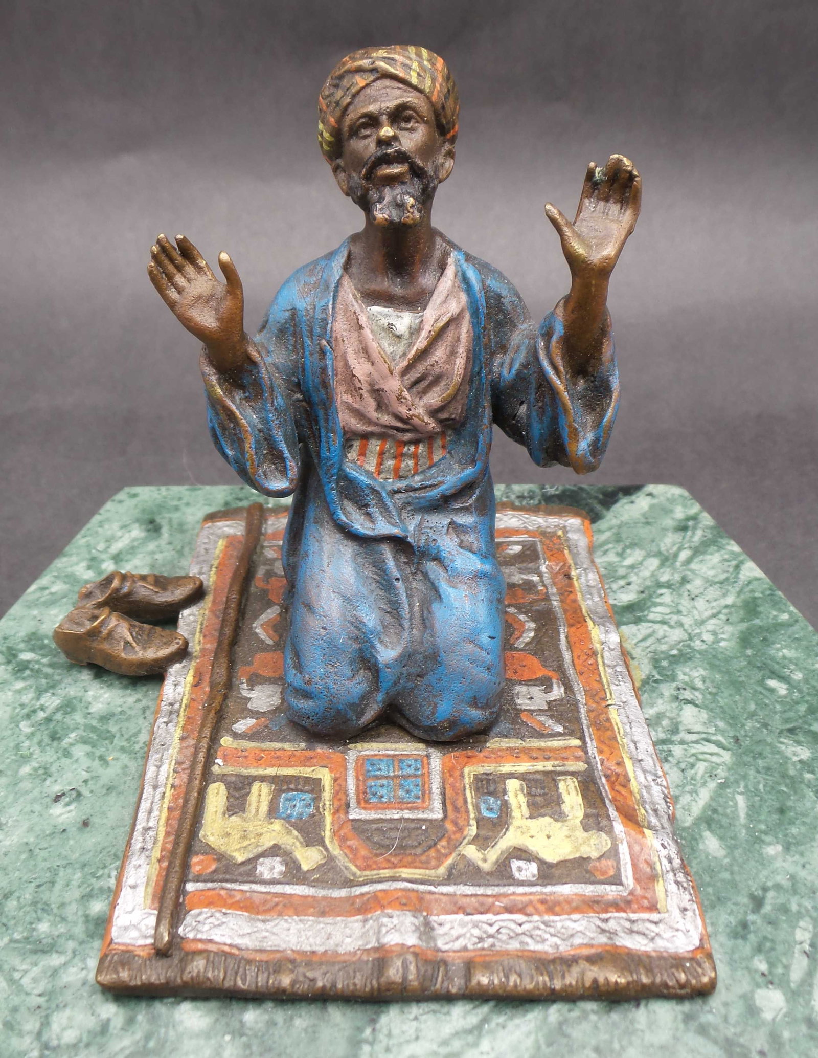Antique ca. 1910 FRANZ BERGMAN (Vienna, 1861-1936) Cold Painted Bronze Praying Man on Carpet /w: Excellent early 20th Century Vienna bronze study of a man at prayer kneeling on his prayer mat with both hands uplifted, his shoes and walking stick to his side. The surface of the bronze with rich co