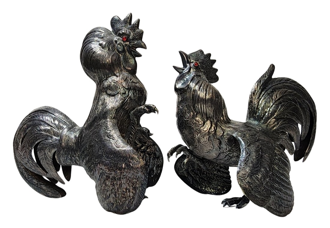 Pair of Vintage ca. 1930 European Silvertone Metal Fighting Roosters /w Red Glass Eyes: Beautiful vintage pieces in very good condition; no missing parts or repairs. Each measures approx. 7" high x 7 1/4" long x 3 1/4" wide and weighs approx. 270/240 grams. Marked "Alpaca".