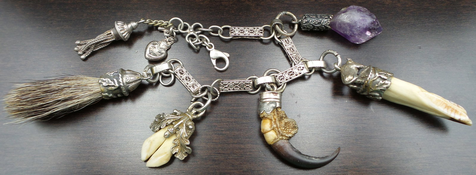 Very Rare Antique European Alpine Silver & Hunting Trophy Chain: This very unusual chain was made around the 1920s in one of the Alpine countries in Europe, likely Austria or Germany. It features several hunting trophies such as deer teeth, a boar's tusk, an eagle 