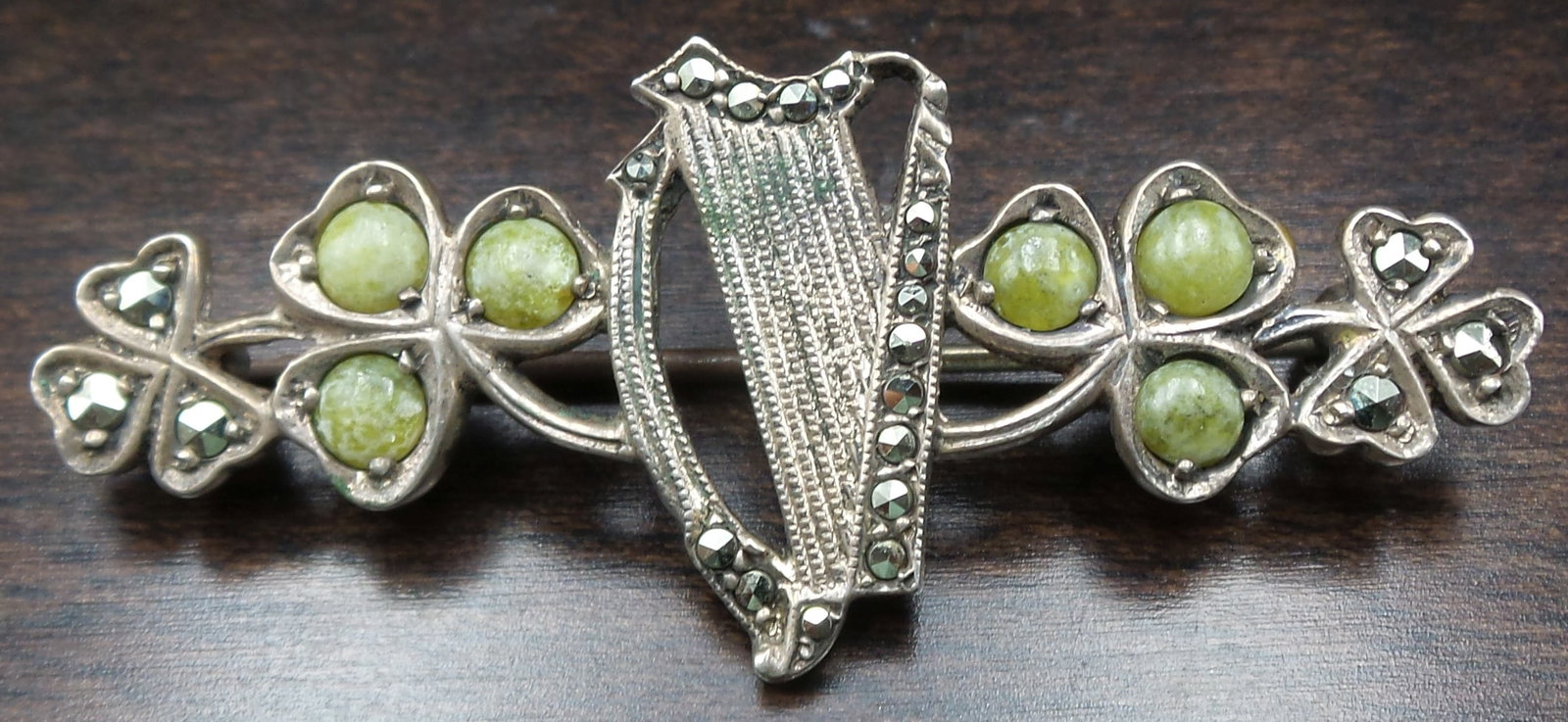 Unusual Mid-Century European Silver & Gemstone Good Luck Harp Brooch: Unusual piece featuring a harp and gemstone adorned clover leaves. The piece is in in very good vintage condition with minor patina according to age. Measures approx. 1 7/8" long x 3/4" wide and weigh