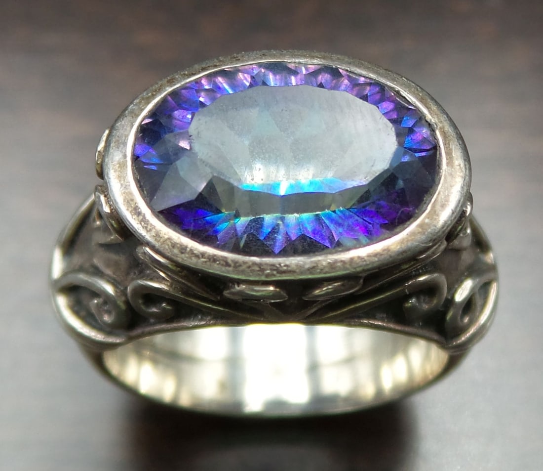 Stylish Vintage Sterling Silver & Purple Rhinestone Ring: The ring is a size 8 1/4, measures approx. 1/2" long x 5/8" wide at the top and weighs ca. 13.9 grams. Marked "925" for Sterling Silver.
