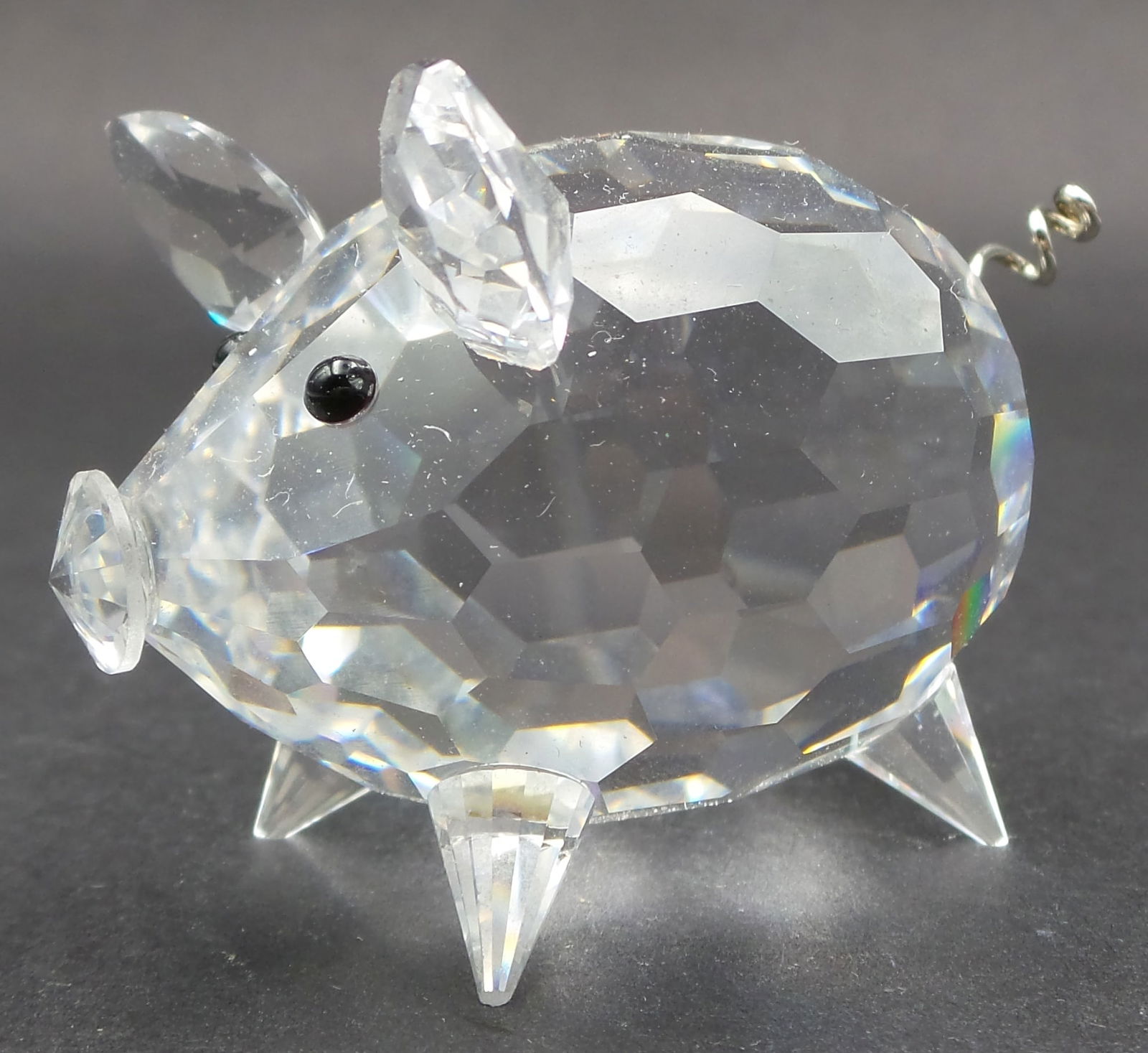 Vintage SWAROVSKI Silver Crystal Piglet Figurine: Good vintage condition; tiny chip to the tip of one leg; no cracks, or repairs. Signed. Measures approx. 1 5/8" high x 1 3/4" wide x 1 3/8" deep.