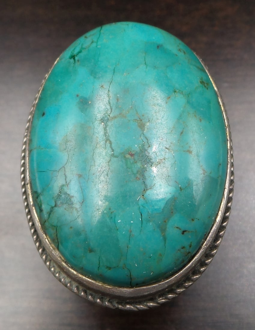 Massive Vintage Sterling Silver & Turquoise Ring: Beautiful and large vintage piece in very good vintage condition with minor patina according to age. The stone measures approx. 1 3/8" long x 1" wide and the ring is a size 9 weighing ca. 18.8 grams. 