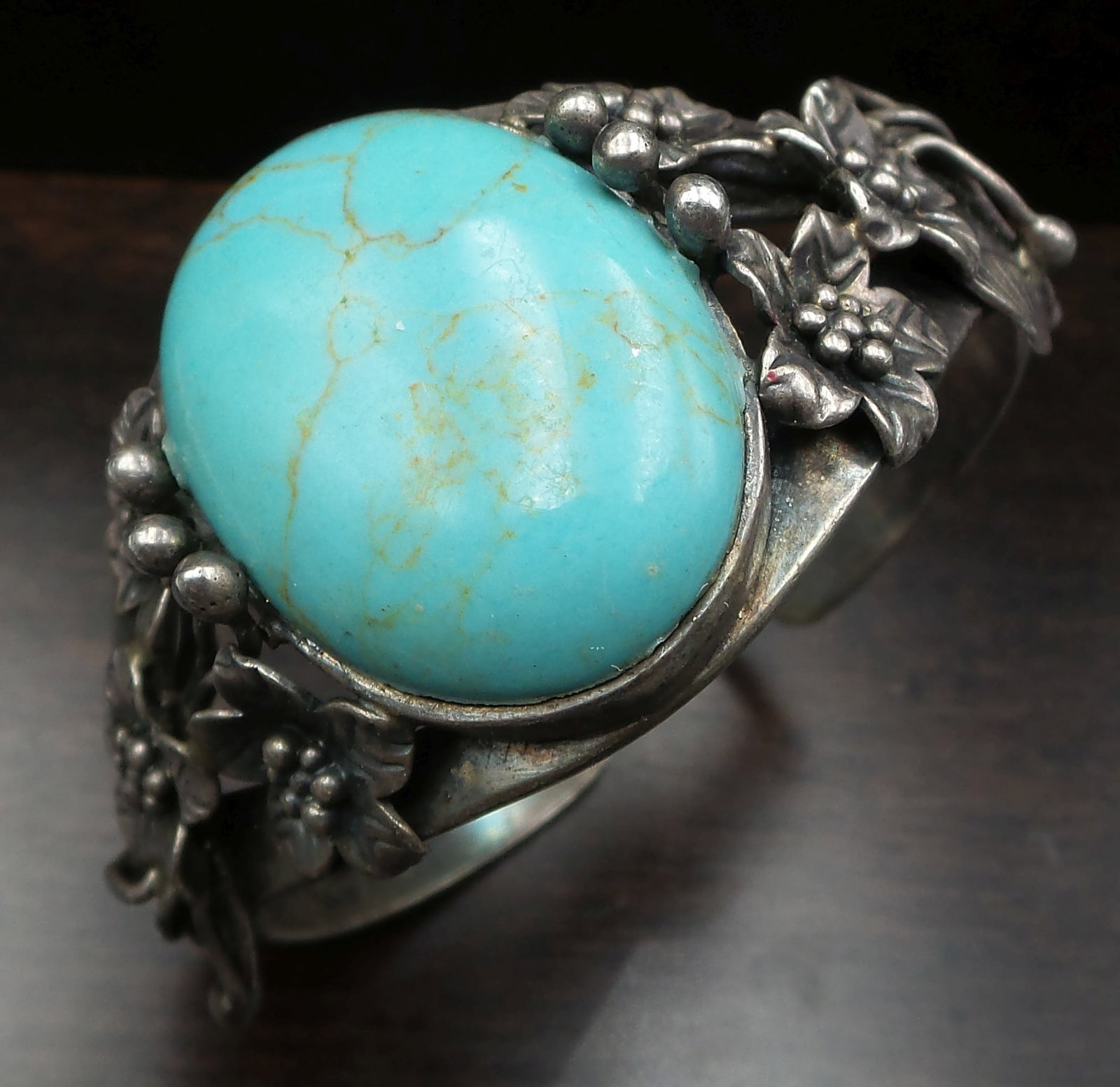 Stylish Vintage Sterling Silver & Turquoise Bracelet: Beautiful and large vintage piece in very good vintage condition with minor patina according to age. The stone measures approx. 1 1/4" long x 7/8" wide and the bracelet has an inside measurements of a