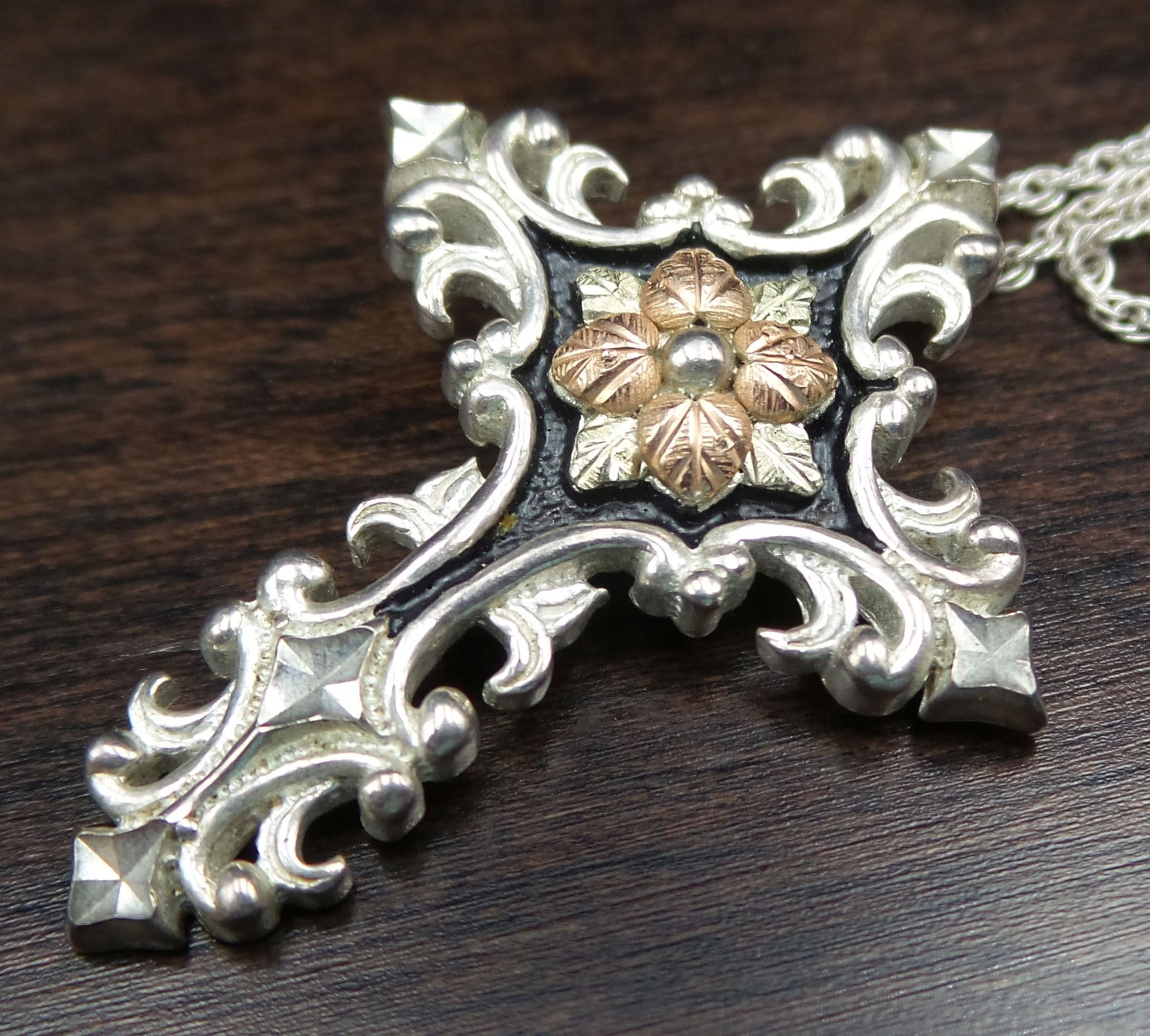 Vintage Sterling Silver Cross Pendant Designer Necklace: Very good vintage condition. Features a magnetic ball clasp. The cross measures approx. 1 1/4" long x 7/8" wide; the chain measures approx. 18" long; total weight is ca. 7.8 grams. Marked on the back.