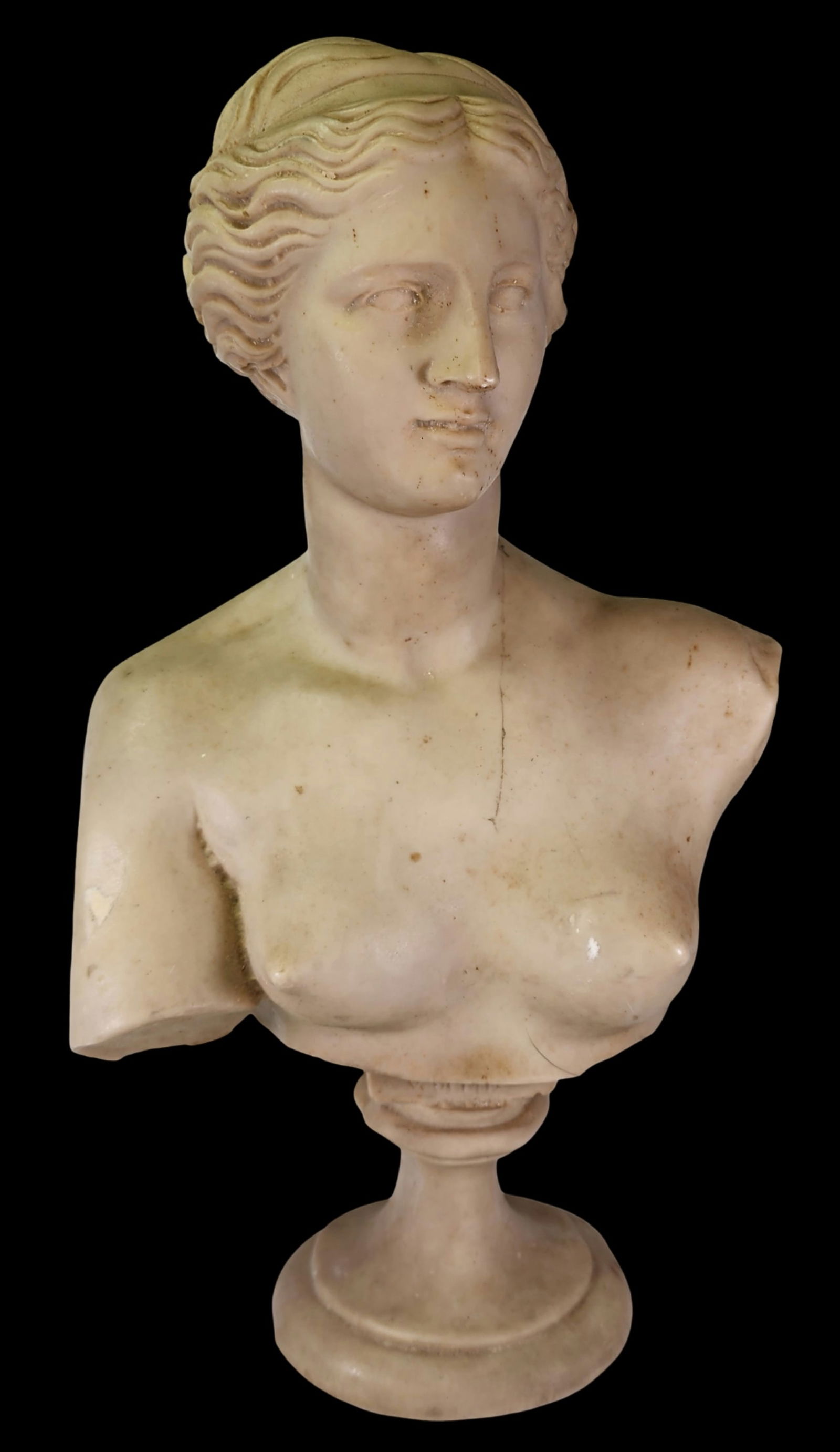 Vintage Neoclassical Bust of "Venus De Milo", Italy, ca. 1950: Mid-20th Century bust of Venus de Milo or Aphrodite, the goddess of love. The sculpture stands on a pedestal base and features exquisite details. This replica is based on the ancient Greek sculpture c