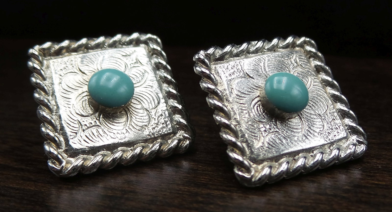Pair of Vintage JJ Jonette Jewelry Company Silvertone Metal & Turquoise Pins: Very pretty pieces measuring approx. 7/8" long x 7/8" wide and weighing ca. 4.6 grams. Very good vintage condition. Signed.