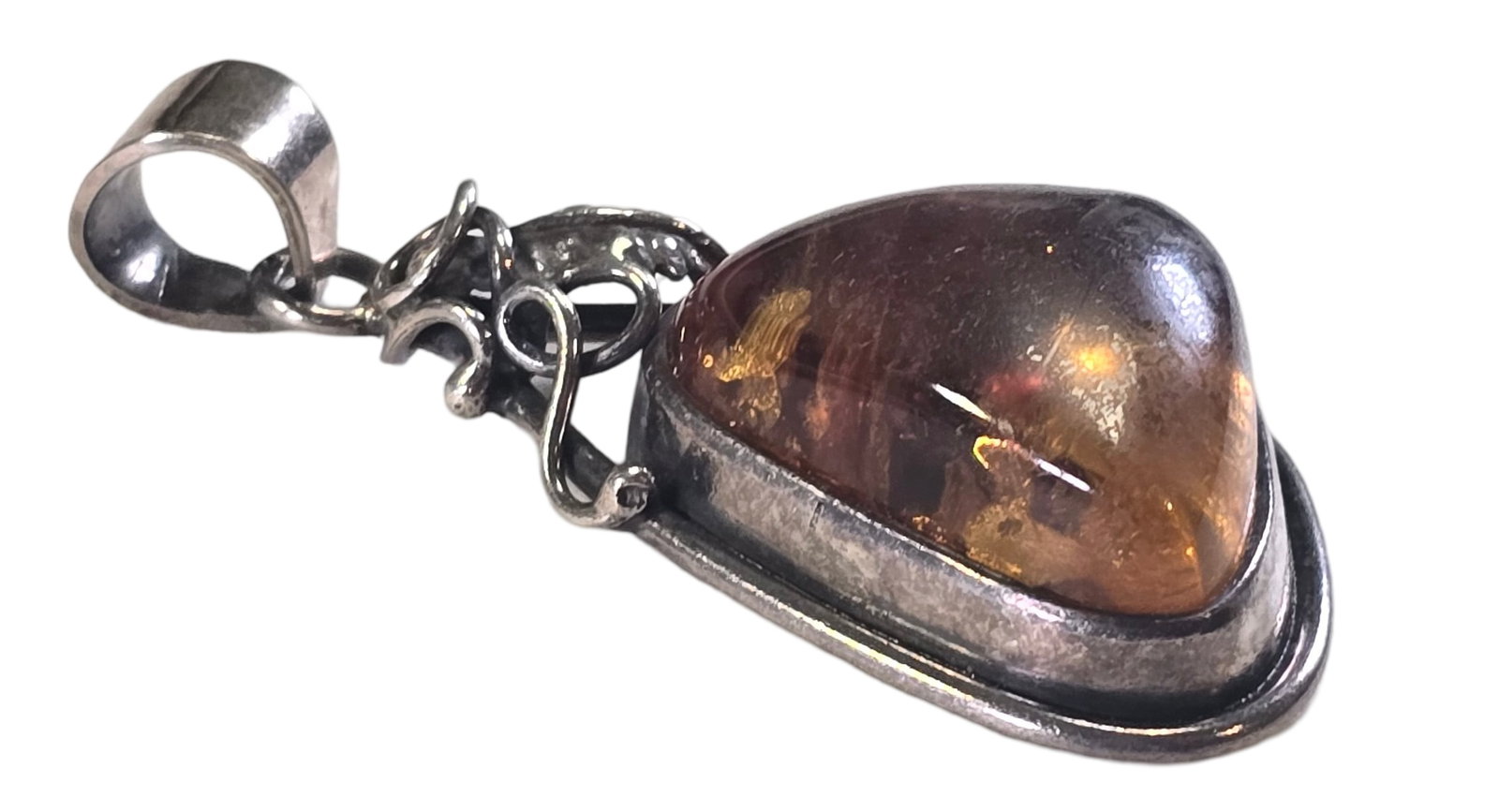 Vintage Mid-Century European 800 Silver & Baltic Amber Pendant: Measures approx. 2" long and weighs ca. 14 grams. Very good vintage condition with minor patina and wear according to age. Tested for a minimum of 800 (80%) silver and carrying unidentified marks. SHI