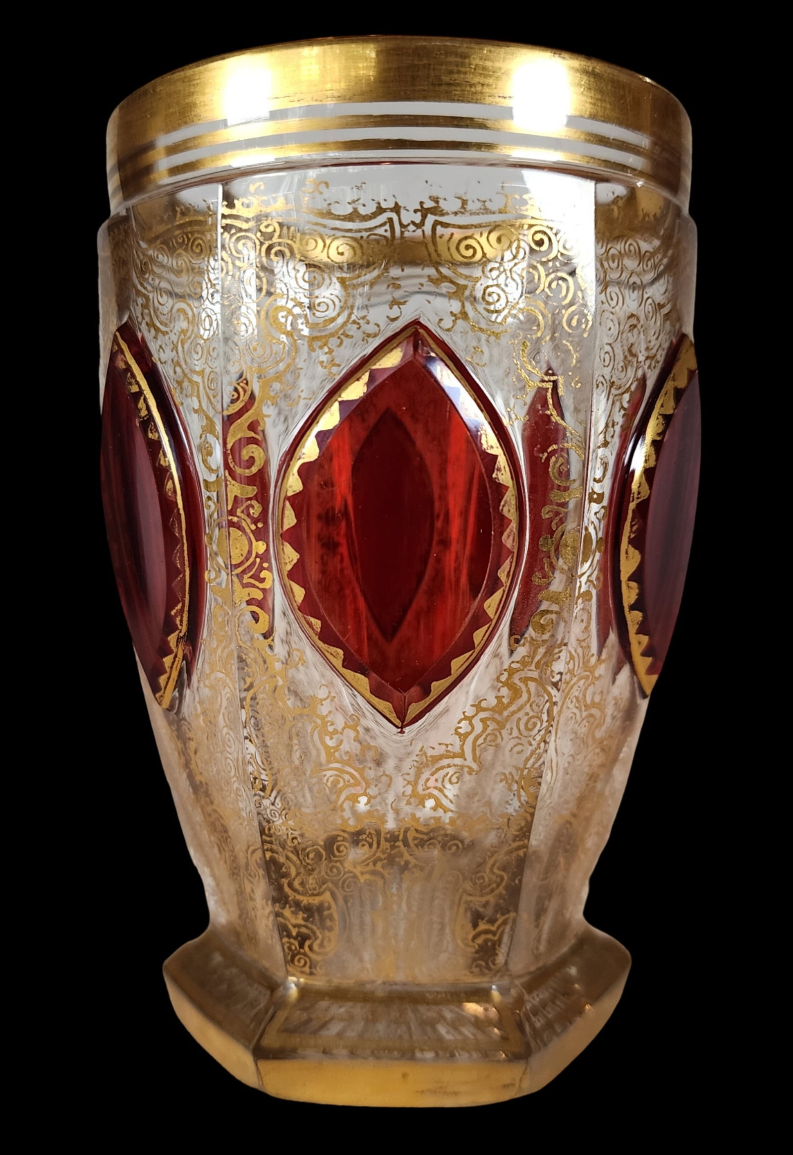 Antique Bohemian Cabochon Gilt Red-to-Clear Water Beaker: Cabochon & raised gilt garnet red to clear water beaker, circa 1900. Gilt foliate scroll and beaded designs throughout with garnet red cabochon panels throughout the piece. Very good antique condition