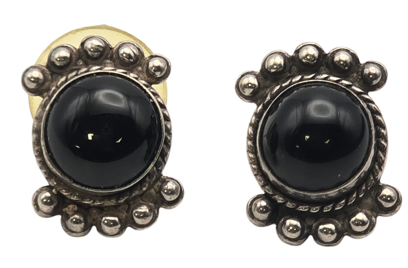 Pair of Vintage Southwestern Sterling Silver & Black Onyx Earrings: Very good vintage condition with some wear and patina according to age. Each measures approx. 1/2" wide and weighs ca. 2.94 grams. Marked for Sterling Silver and signed. SHIPPING: We ship in-house and