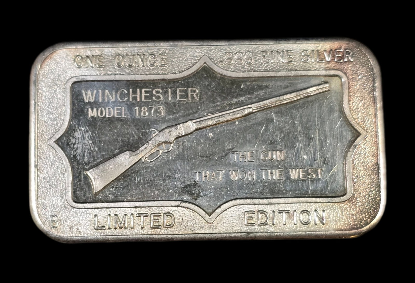 Vintage 1 oz 999 Fine Silver Winchester Rifle Ingot: Very good vintage condition with some patina according to age, please see pictures. Measures approx. 2" wide and 1" long and weighs ca. 33 grams. Marked.