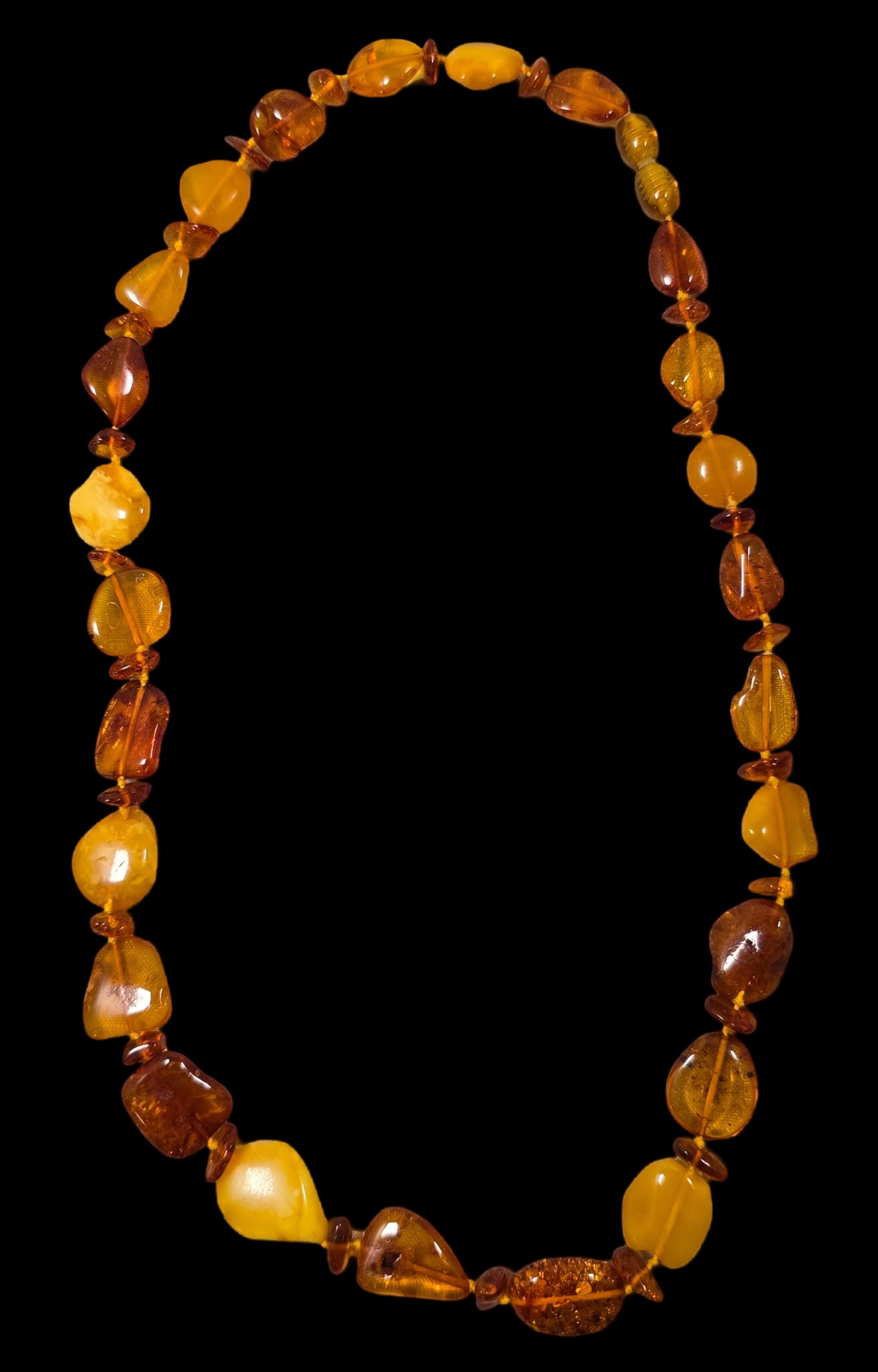 Vintage European Baltic Amber Necklace: Very good vintage condition with some patina according to age, please see pictures. Measures approx. 9" long.
