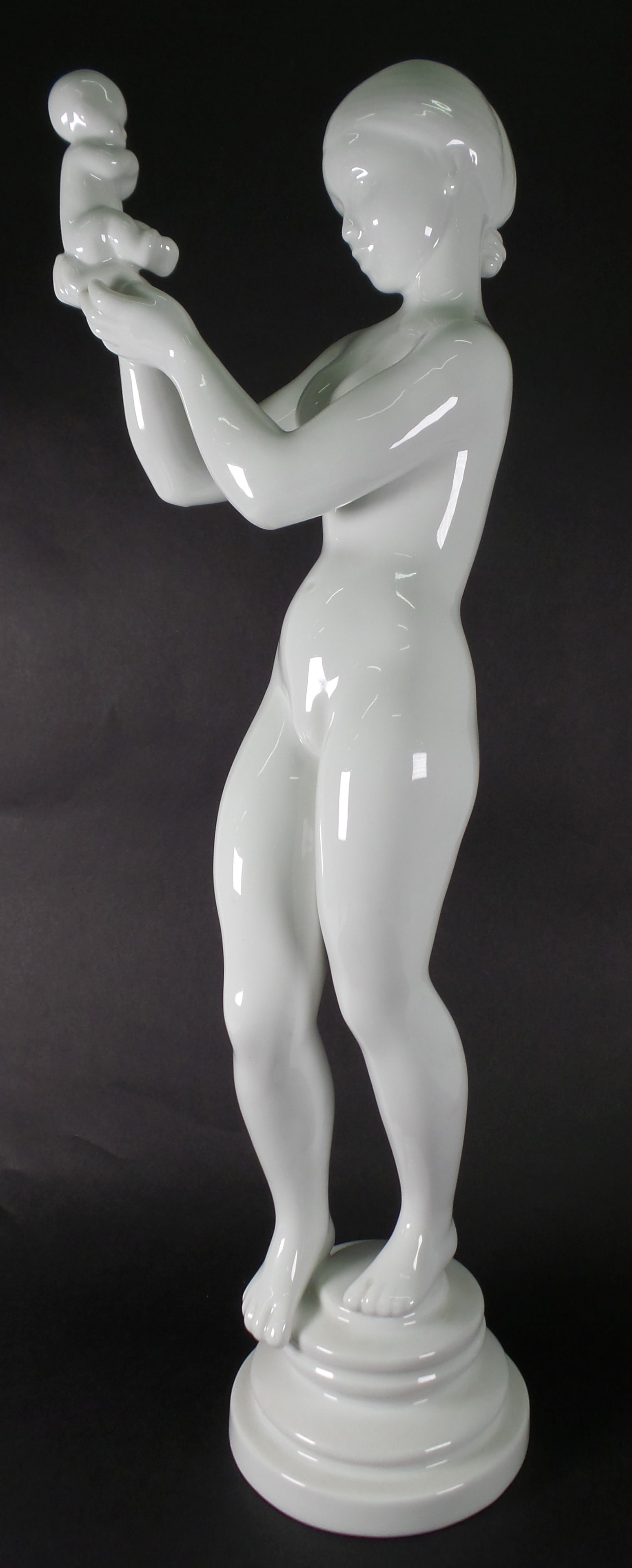 Antique Art Nouveau KAI NIELSEN (1882-1924) for Bing & Grondahl Porcelain Mother: A stylish Danish porcelain Mother & Child sculptural figure designed by Kai Nielsen (1882-1924) for Bing & Grondhal and dating from the early 20th century. The figure portraying a naked girl stands on