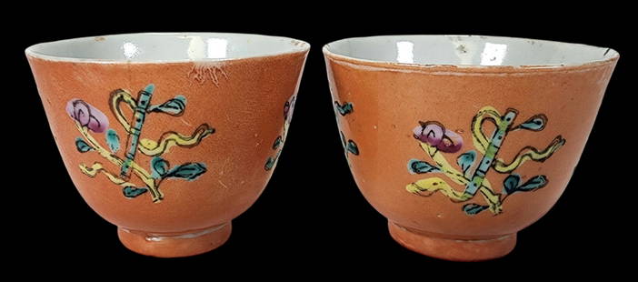 Pair of Antique Chinese Qing Dynasty Coral Ground Porcelain Tea Cups: Pair of Antique 19th Century Chinese Coral Ground Porcelain Tea Cups. Floral medallion details in shades of yellow, green and pink. Good antique condition with some wear according to age. Each cup mea