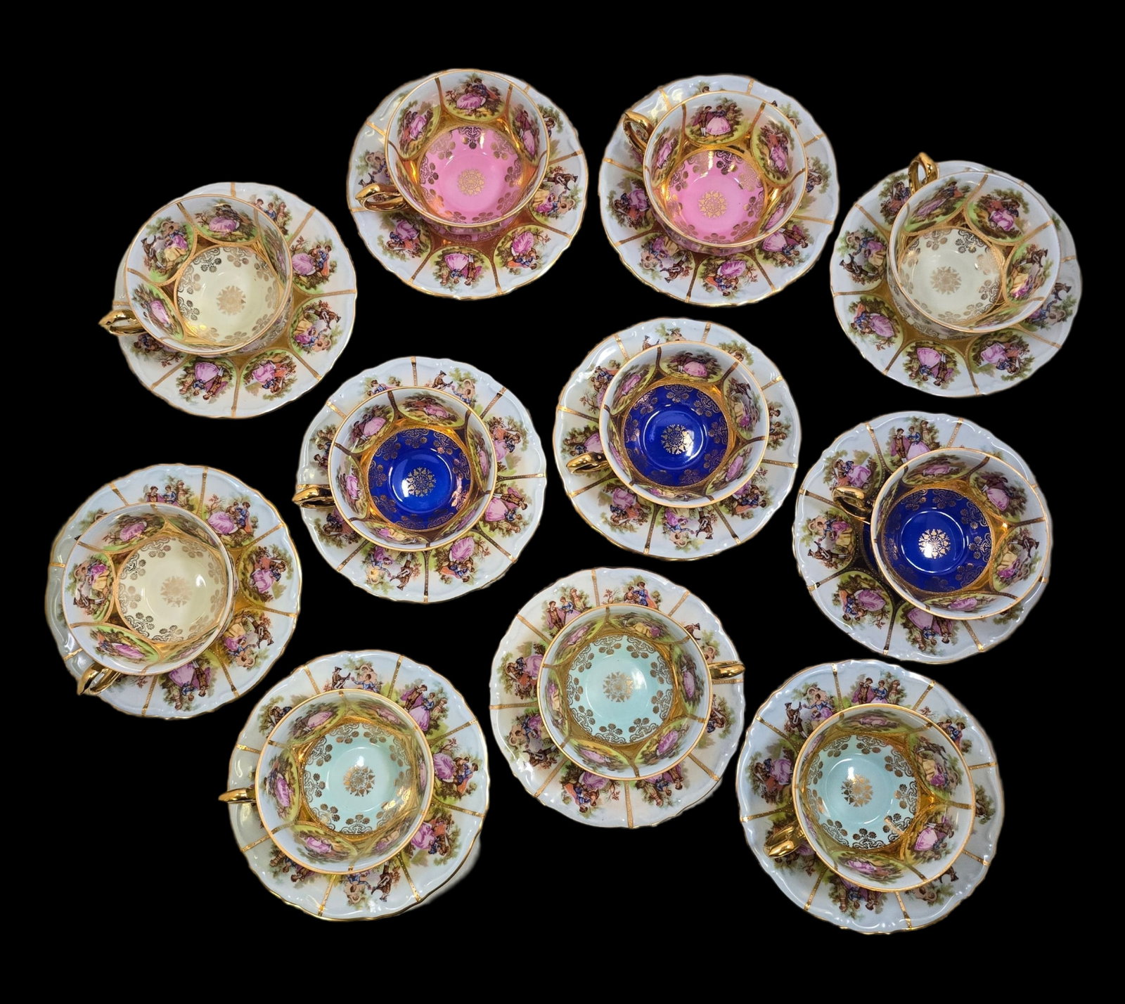 Lot of 11 Bavarian Porcelain Cup and Saucer Tea Sets: Very good vintage condition; no chips, cracks, or repairs. Minor wear according to age. Each measures approx 2" high (cup) x 4 1/2" in diameter (saucer). Marked on the bottom.