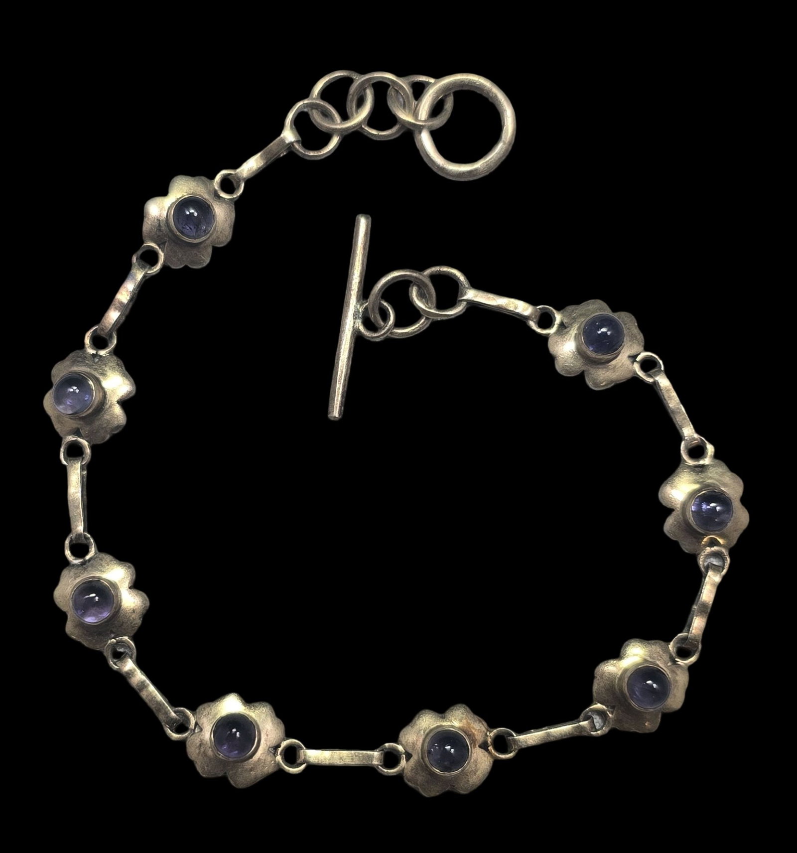 Vintage Gilt Sterling Silver & Tanzanite Toggle Bracelet: Very good vintage condition with minor patina and wear according to age. Measures approx. 8 1/2' long and weighs ca. 6.5 grams. Marked for Sterling Silver. SHIPPING: We ship in-house and charge a flat