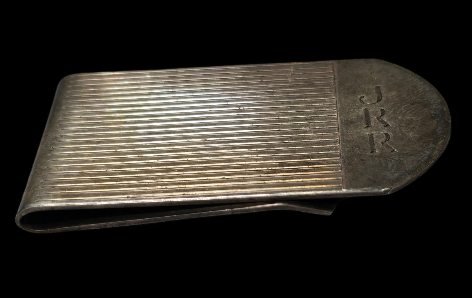 Luxurious Vintage CARTIER Sterling Silver Money Clip: Very good vintage condition with some patina according to age, monogrammed, please see pictures. Measures approx. 2" wide and 1 1/2" long and weighs ca. 28 grams. Marked.