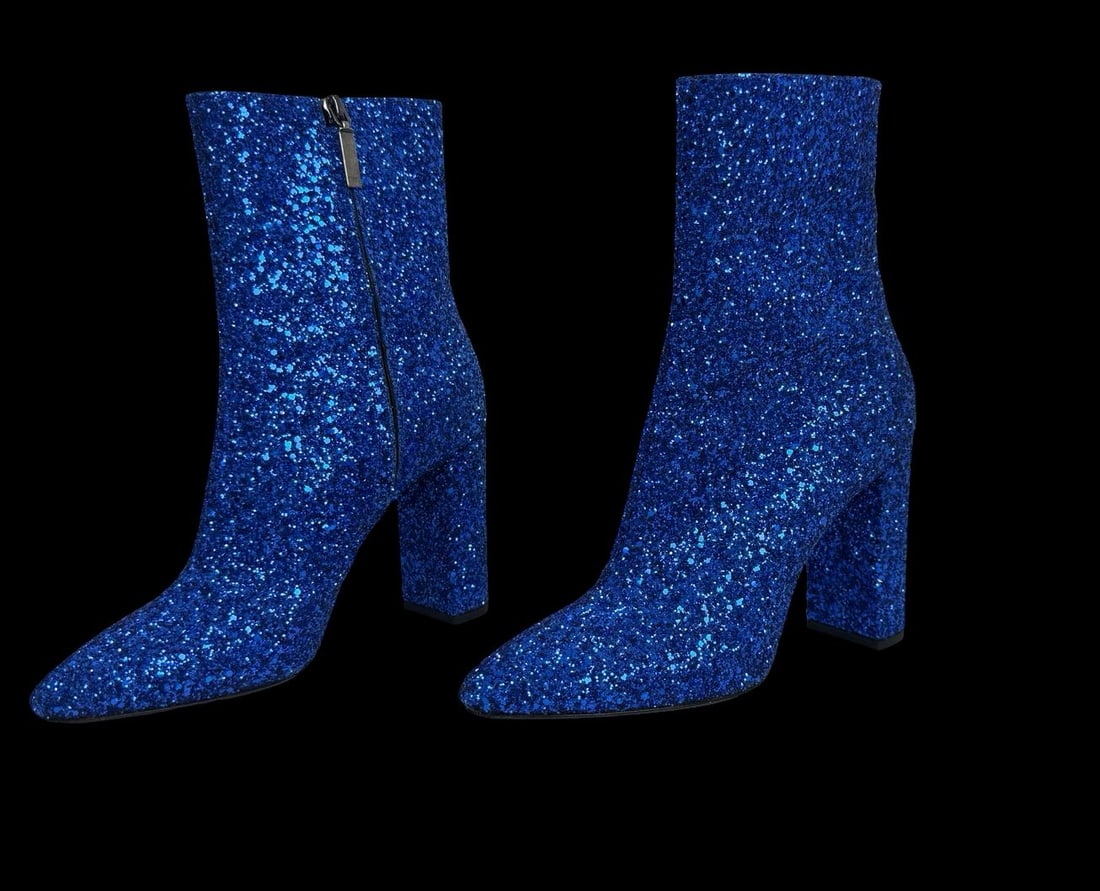 YVES SAINT LAURENT Lou 95 Blue Glitter Ankle Boots - Never Worn: A pair of YVES SAINT LAURENT Lou 95 ankle boots known for their sleek design featuring a pointed toe, a block heel, and a side zipper. Very good pre-loved condition; never worn. Minimal signs of wear