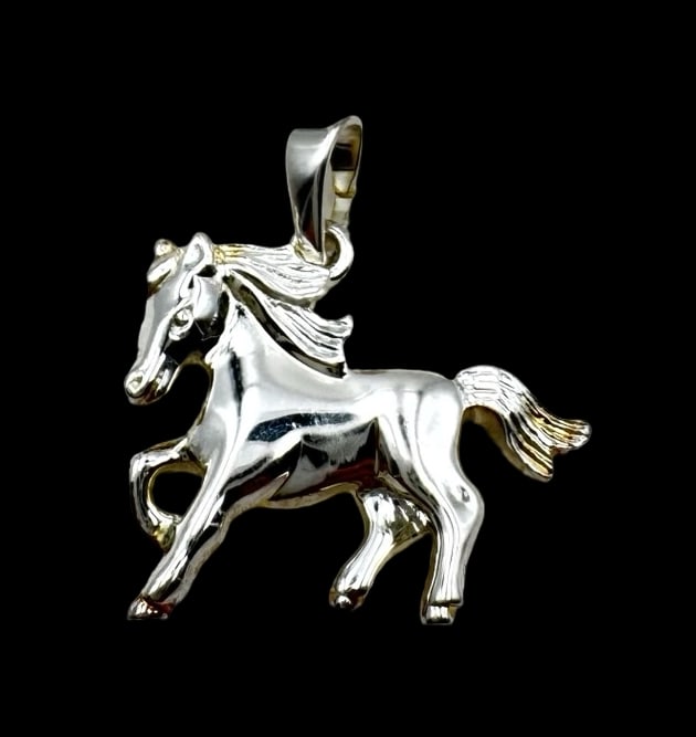 Vintage Sterling Silver Horse Pendant Charm: Very good vintage condition with minor patina according to age. Measures approx. 7/8" long x 5/8" wide and weighs ca. 1.9 grams. Marked for Sterling Silver and carrying an unidentified designer mark. 