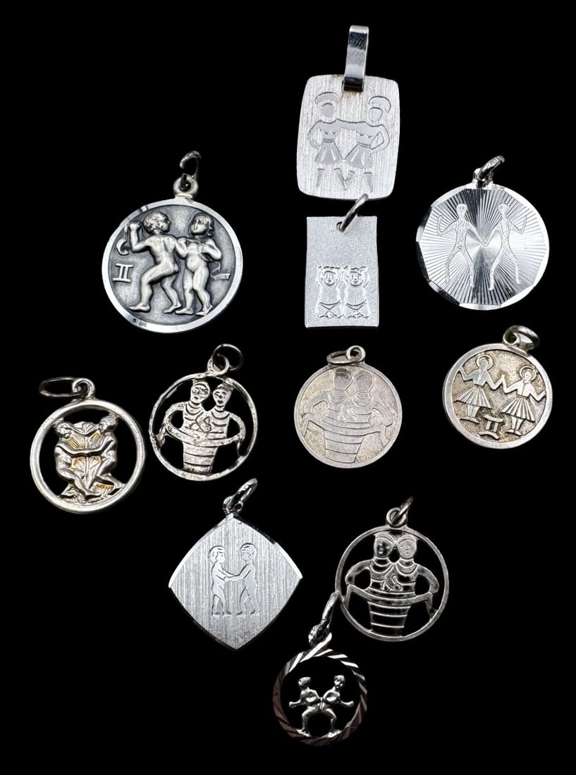Lot of 11 Vintage Sterling Silver Zodiac Sign Pendant Charms - Gemini: Very good vintage condition with minor patina according to age. The largest measures approx. 3/4" in diameter and they jointly weigh ca. 16.8 grams. Marked for Sterling Silver. SHIPPING: We ship in-ho