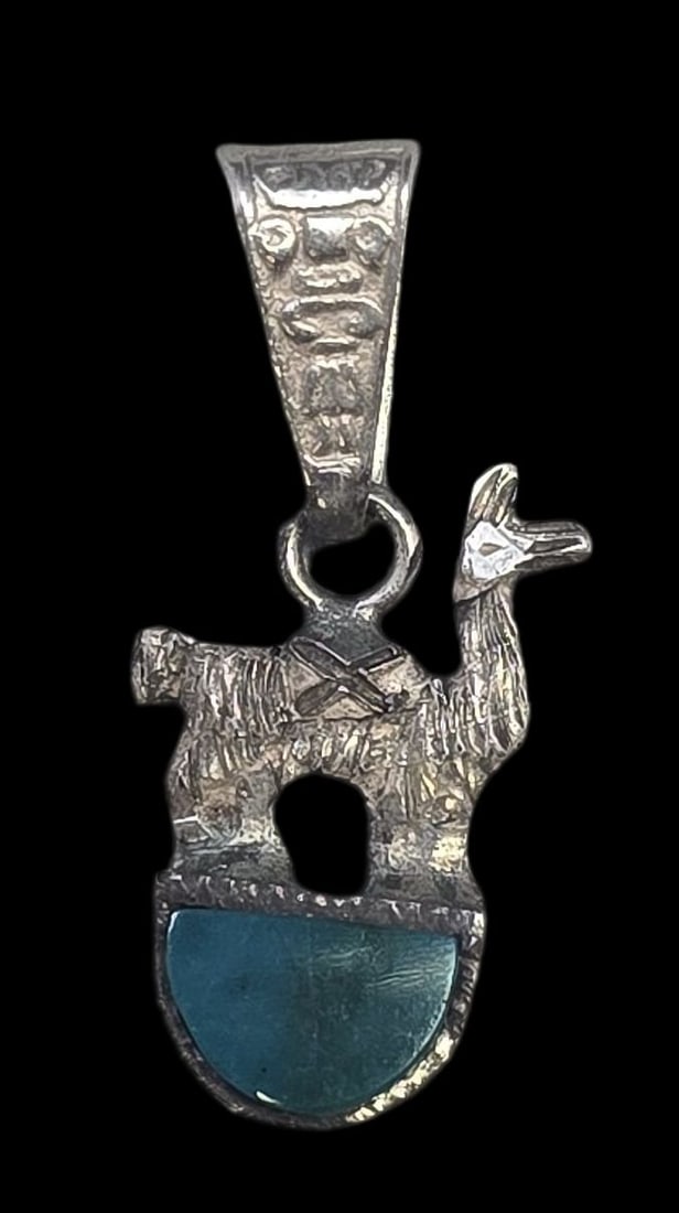 Vintage Peruvian Sterling Silver & Green Gemstone Lama Pendant: Very good vintage condition with minor patina and wear according to age. Measures approx. 1/2" high and weighs ca. 1.5 grams. Tested for Sterling Silver. SHIPPING: We ship in-house and charge a flat f