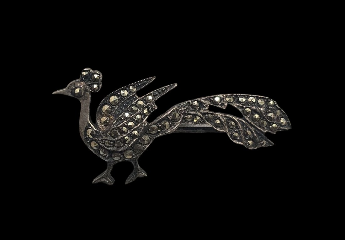 Charming Vintage Sterling Silver & Marcasite Peacock Brooch: Very good vintage condition with minor patina and wear according to age. Measures approx. 1 1/2" wide and weighs ca. 4 grams. Tested for Sterling Silver. SHIPPING: We ship in-house and charge a flat f
