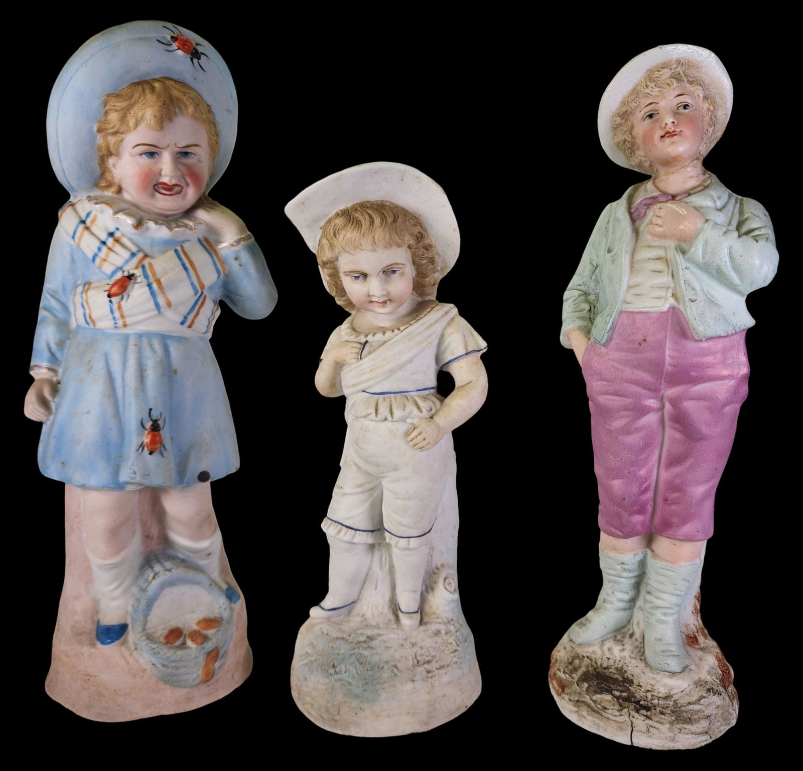 Set of 3 Antique European Bisque Porcelain Figurines: Beautiful set of 3 antique European Bisque Porcelain children's figurines. Very good antique condition; no chips, cracks, or repairs; minor wear according to age. The tallest measures approx. 10" tall
