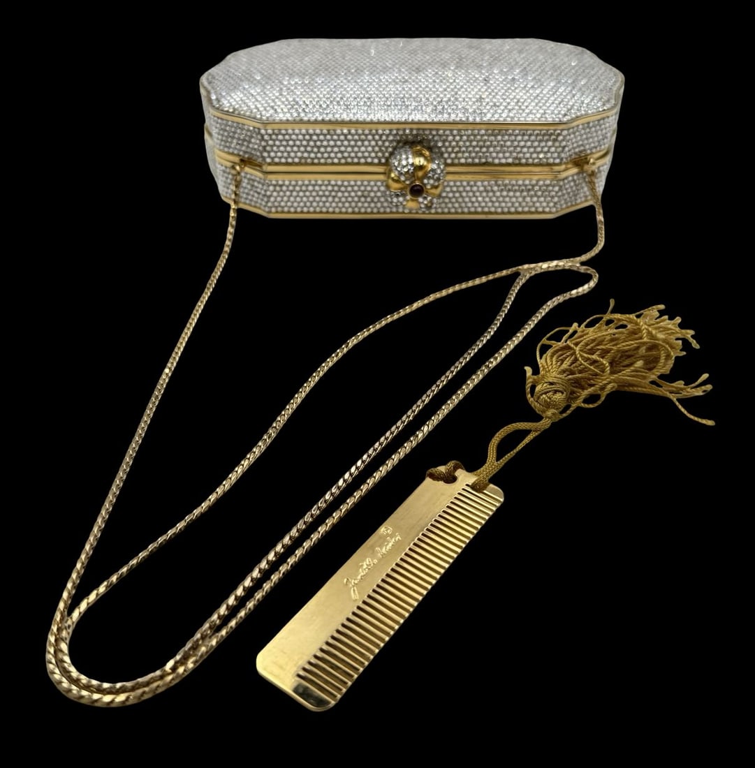 Stunning Vintage JUDITH LEIBER Goldtone Metal & Swarovski Crystal Clutch: Very good vintage condition; no chips, cracks, or repairs. Measures approx. 7" long x 4 1/2" wide x 1 5/8" deep. Missing a few stones. Marked JUDITH LEIBER.