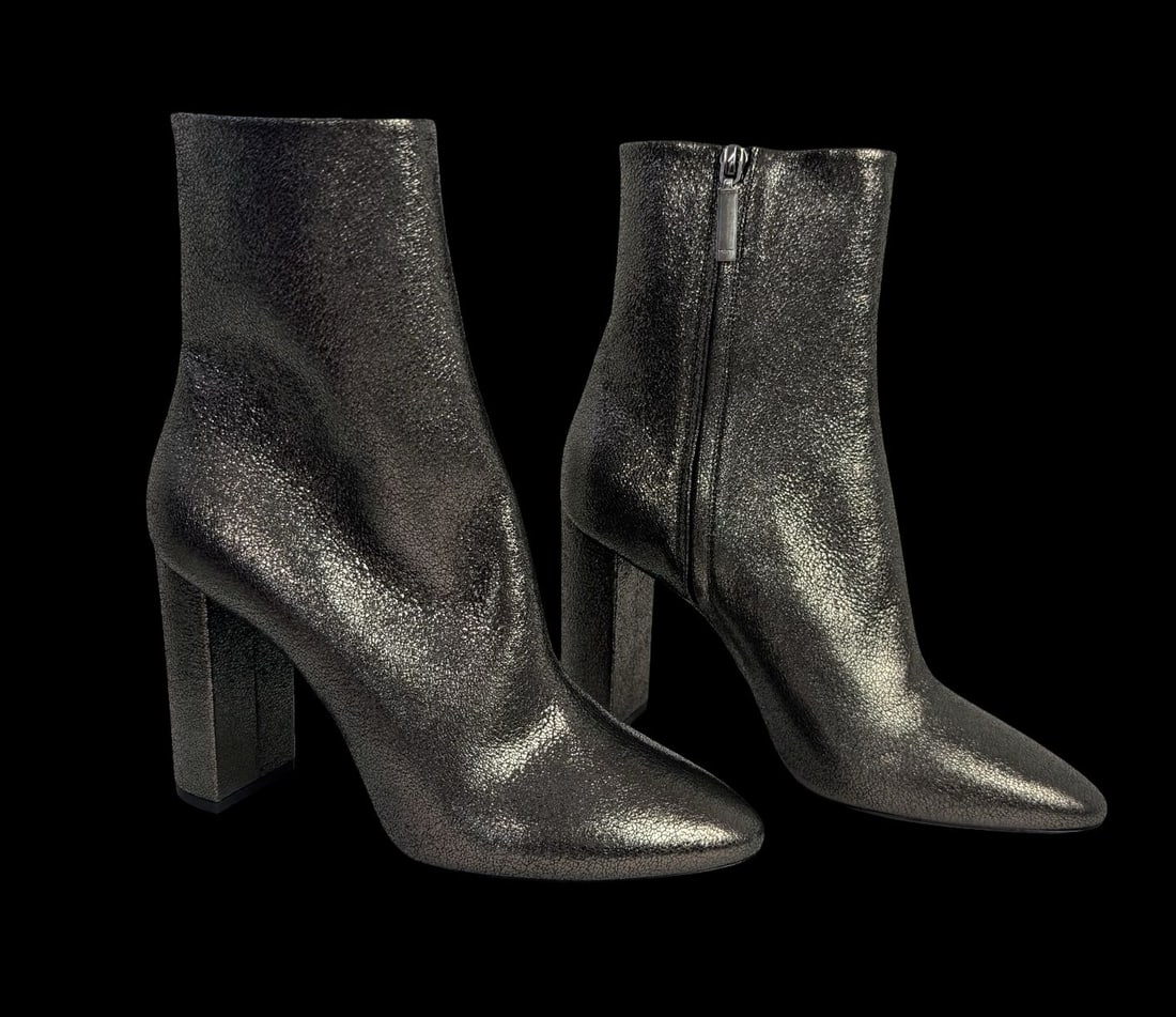 YVES SAINT LAURENT Lou Ankle Boots - Never Worn: A pair of YVES SAINT LAURENT Lou Ankle boots known for their sleek design featuring a pointed toe, a block heel, and a side zipper. Very good pre-loved condition; never worn. Minimal signs of wear fro