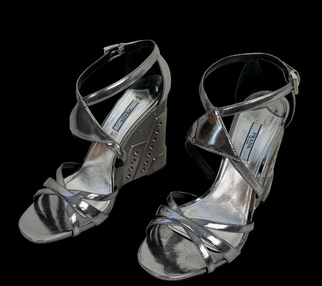 PRADA Silver chrome wedge Sandals Straps Incredible metal Plated - Previously Worn: PRADA Silver chrome wedge Sandals Straps Incredible metal Plated Made in Italy known for their sleek design featuring a pointed toe, a block heel. Good pre-loved condition; Previously Worn. Some signs