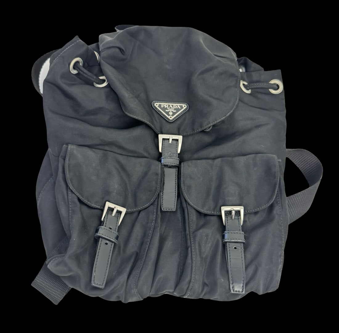 PRADA Small Re-Nylon Black Backback - Barely Worn: PRADA Small Re-Nylon Backback. Very good condition. Measures approx. 12" high and 11" wide. Some signs of wear from use and storage. Barely Worn