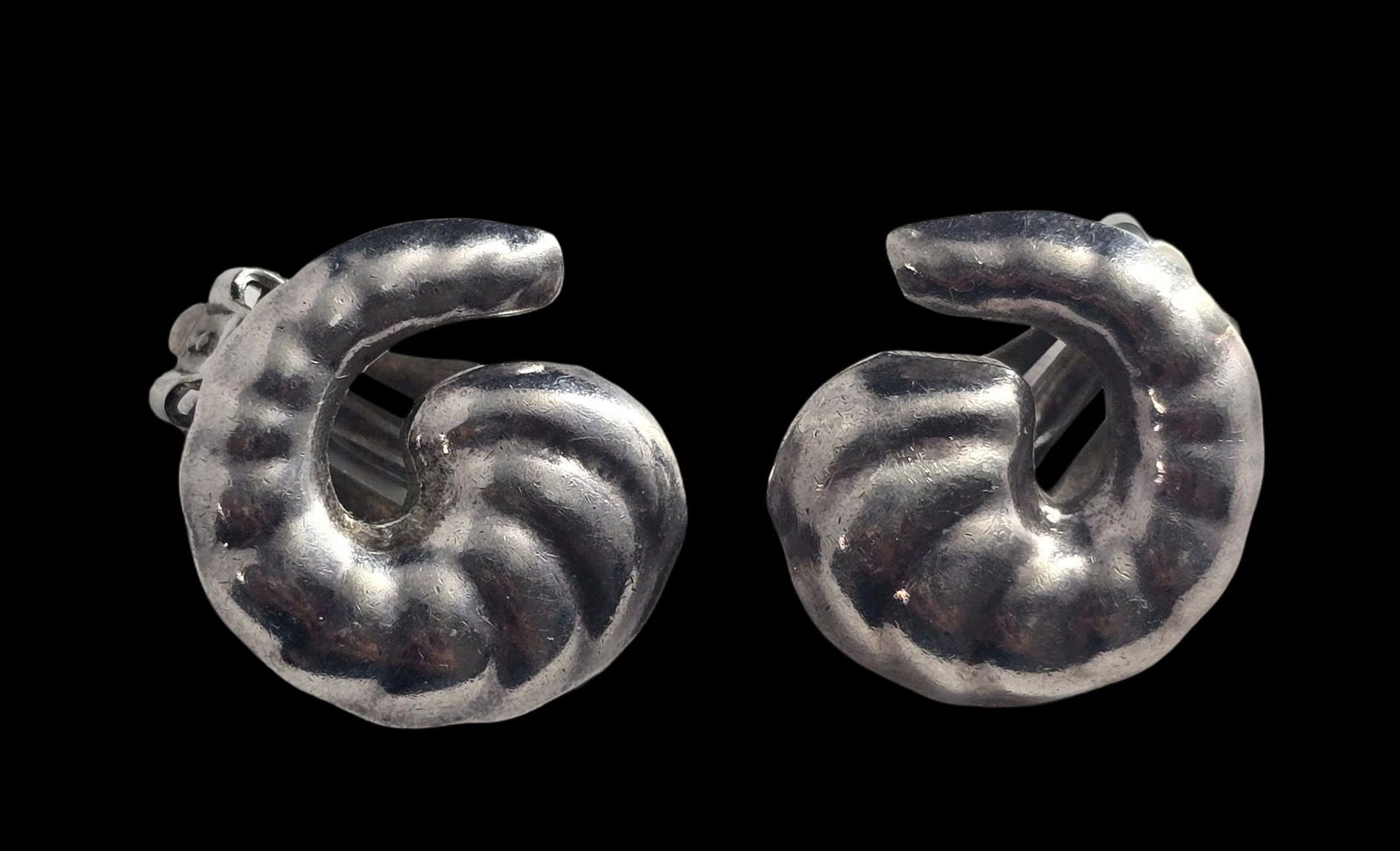 Unusual Vintage Mexican Sterling Silver Cornucopia Clip-On Earrings: Very good vintage condition with minor patina according to age. Each measures approx. 1" in diameter and they jointly weigh ca. 6 grams. Marked for Sterling Silver. SHIPPING: We ship in-house and char