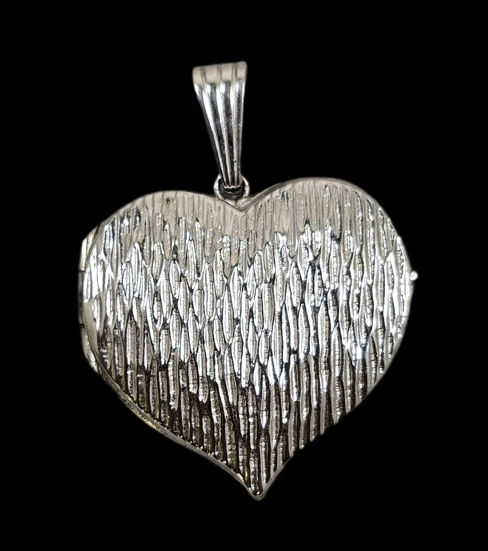 Vintage European 800 Silver Heart Locket Pendant: Very good vintage condition with some wear and patina according to age. Measures approx. 1" high x 1" wide and weighs ca. 6.5 grams. Marked for 800 (80%) silver. SHIPPING: We ship in-house and charge