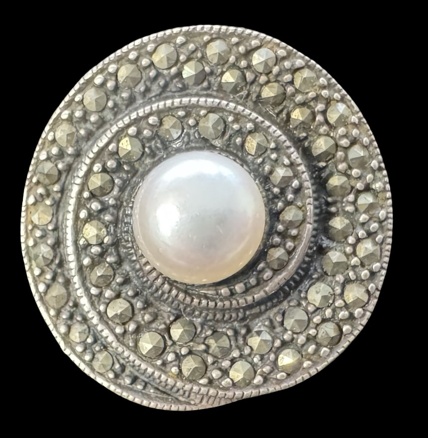 Vintage Sterling Silver, Marcasite & Pearl Ring: Very good vintage condition with minor patina according to age. Measures approx. 7/8" in diameter and weighs ca. 6.8 grams. The ring is a size 6. Tested for Sterling Silver. SHIPPING: We ship in-house