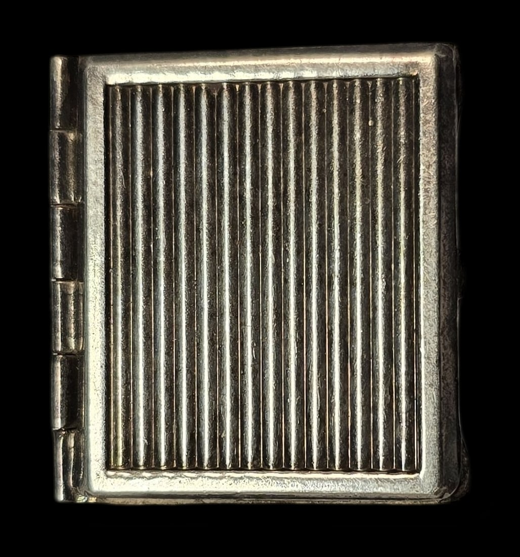 Vintage Sterling Silver Book Shaped Picture Locket Pendant: Very good vintage condition with minor patina and wear according to age. Measures approx. 1" wide and weighs ca. 11 grams. Marked for Sterling Silver. SHIPPING: We ship in-house and charge a flat fee