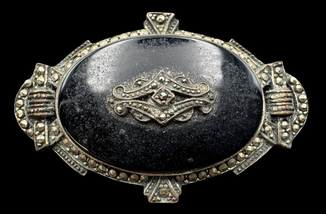 Antique European 1900s 835 Silver, Black Onyx & Marcasite Brooch: Very good antique condition with minor patina according to age. Measures approx. 1 3/4" long x 1 1/4" wide and weighs ca. 10 grams. Marked for 835 Silver. SHIPPING: We ship in-house and charge a flat