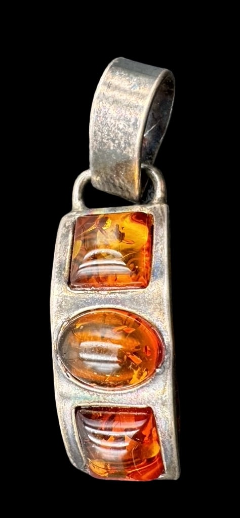 Vintage Mid-Century Sterling Silver & Amber Designer Pendant: Very good vintage condition with minor patina according to age. Measures approx. 1 1/4" long x 1/4" wide and weighs ca. 2.9 grams. Marked for Sterling Silver & Designer Signed. SHIPPING: We ship in-ho