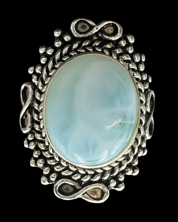 Ornate Vintage Gilt Sterling Silver & Blue Larimar Ring: Very good vintage condition with minor patina according to age. Measures approx. 1" long x 3/4" wide and weighs ca. 7.3 grams. The ring is a size 6 1/2. Marked for Sterling Silver. SHIPPING: We ship i
