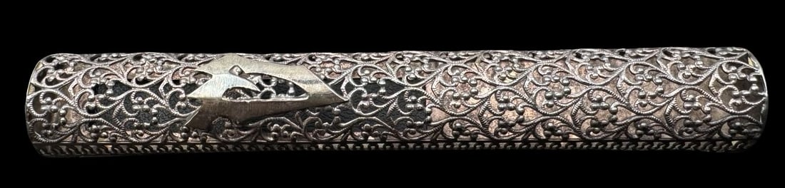 Vintage Judaica Jewish Sterling Silver Filigree Mezuzah: Very good vintage condition with minor patina according to age. Measures approx. 5 1/4" long x 3/4" wide and weighs ca. 17.4 grams. Marked for Sterling Silver and "Made in Israel".