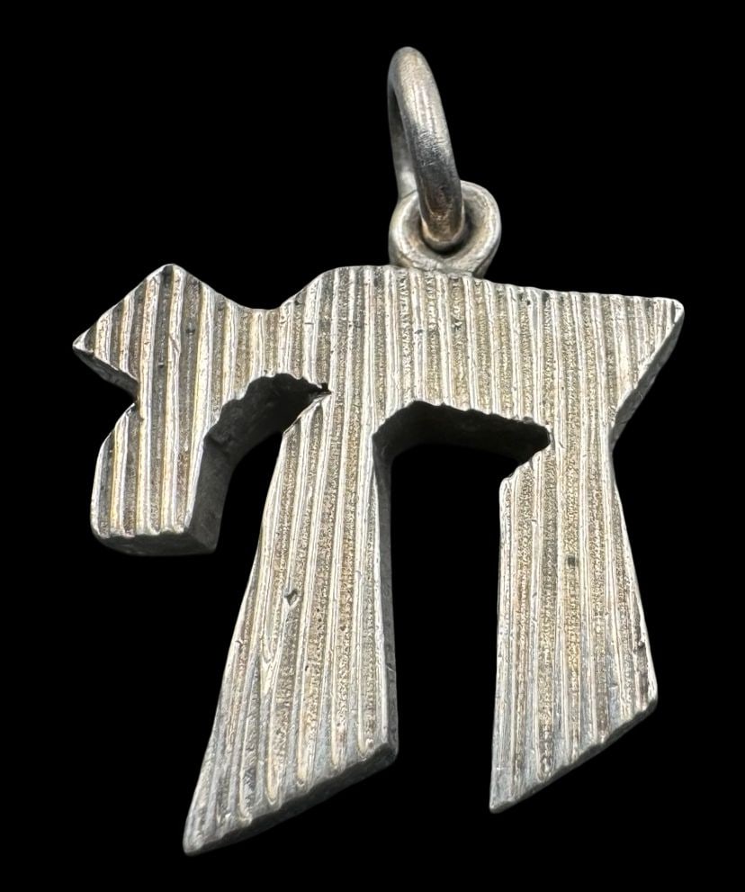 Vintage Jewish Sterling Silver Hebrew Symbol Chai "Life" Amulet Pendant - Judaica: Very good vintage condition with minor patina according to age. Measures approx. 1 1/8" long x 3/4" wide and weighs ca. 8.8 grams. Marked for Sterling Silver.