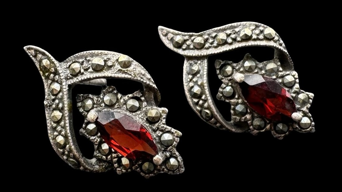 Vintage Sterling Silver, Marcasite & Red Gemstone Earrings: Very good vintage condition with minor patina according to age. Each measures approx. 7/8" long x 1/2" wide and they jointly weigh ca. 4 grams. Marked for Sterling Silver.