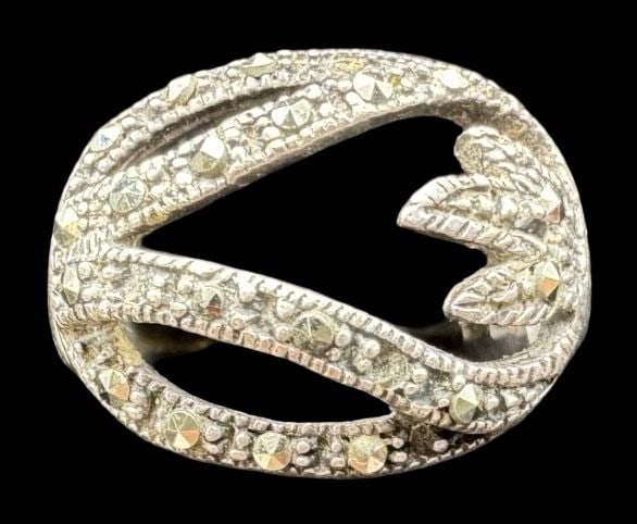 Ornate Vintage Sterling Silver & Marcasite Ring: Very good vintage condition with minor patina according to age. Measures approx. 3/4" long x 5/8" wide & weighs ca. 5.4 grams. The ring is a size 5 1/2. Marked for Sterling Silver.