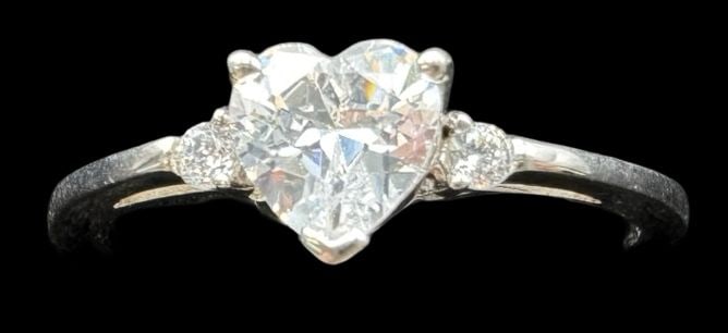 Beautiful Vintage Sterling Silver & Clear Heart Cut Gemstone Solitaire Ring: Very good vintage condition with minor patina according to age. Gemstone Measures approx. 1/4" long x 1/4" wide & weighs ca. 2.2 grams. The ring is a size 10. Marked for Sterling Silver.