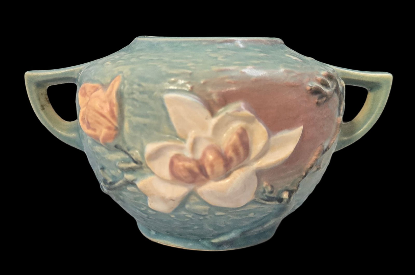 Vintage ROSEVILLE Art Pottery MAGNOLIA Blue Vase: Very good vintage condition with minor wear according to age, please see pictures. No cracks or repairs. Measures approx. 4" high x 8" wide. Marked.