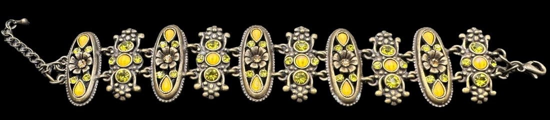 Stylish Vintage Yellow Rhinestone Costume Jewelry Bracelet: Very good vintage condition with minor patina according to age. Measures approx. 7" long x 1 1/4" wide.