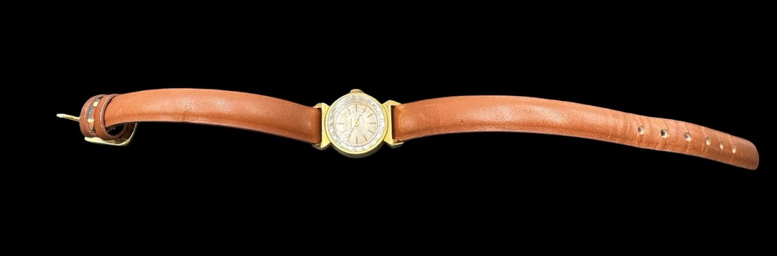 Vintage Swiss OMEGA Gold-Tone Metal & Leather Strap Women's Wristwatch: Very good vintage condition with minor patina according to age. Measures approx. 5/8" indiameter. Marjed for OMEGA