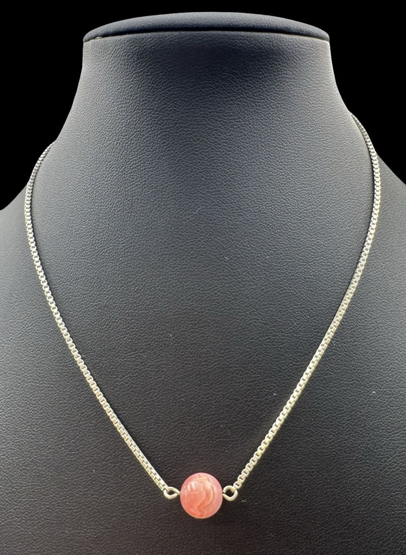 Vintage Mid-Century Sterling Silver Necklace /w Pink Rhodochrosite Bead: Very good vintage condition with minor patina according to age. Pendant measures approx. 5/8" long and 3/8" wide; necklace is approx. 15" long & the joint weight is ca. 6.1 grams. Marked for Sterling 