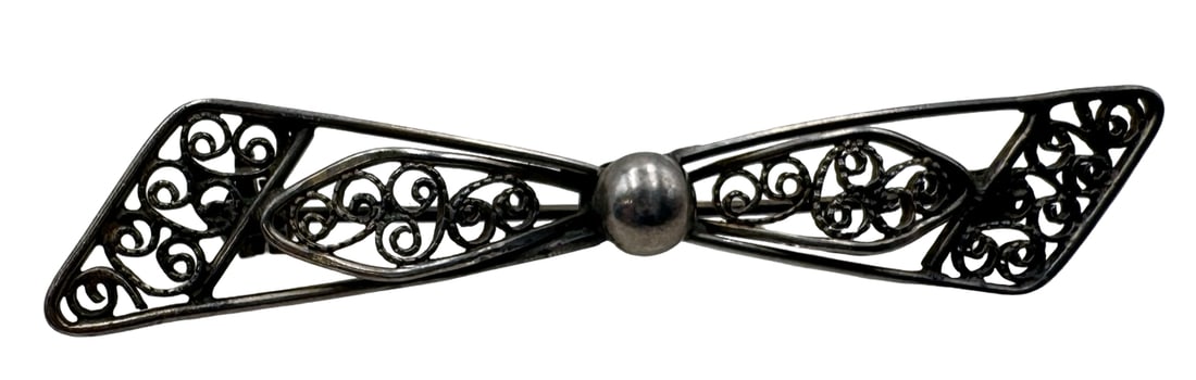 Charming Vintage European 835 Silver Filigree Bow Brooch: Very good vintage condition with minor patina according to age. Measures approx. 2 1/4" long x 1/2" wide and weighs ca. 2.9 grams. Marked for 835 (83.5%) silver. SHIPPING: We ship in-house and charge 