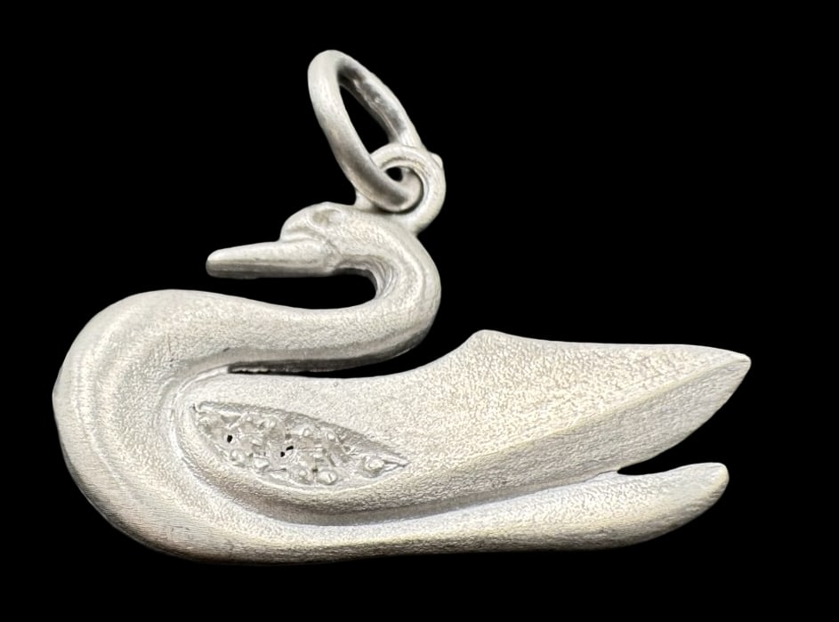 Vintage Sterling Silver Swan Pendant Charm: Very good vintage condition with minor patina according to age. Pendant measures approx. 7/8" long and 1/2" wide & weighs ca. 1.3 grams. Marked for Sterling Silver. SHIPPING: We ship in-house and char